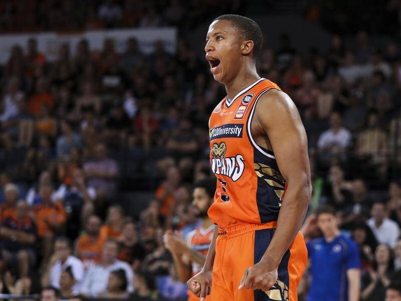 Devon Hall of the Taipans celebrates during the round 12 NBL match between Cairns and Brisbane.