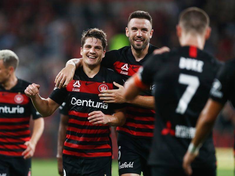 Mitchell Duke (left) scored twice as Western Sydney beat Adelaide United 5-2 in the A-League.