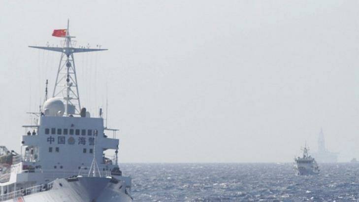 Ships of Chinese Coast Guard are seen near the Chinese oil rig Haiyang Shi You 981 in disputed waters in the South China Sea.