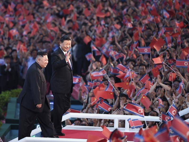 China's Xi was greeted in North Korea with a lavish spectacle in the capital Pyongyang.