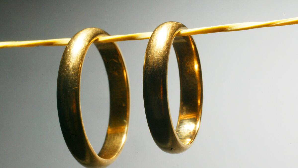 Generic photo of wedding rings on string. Picture is from file