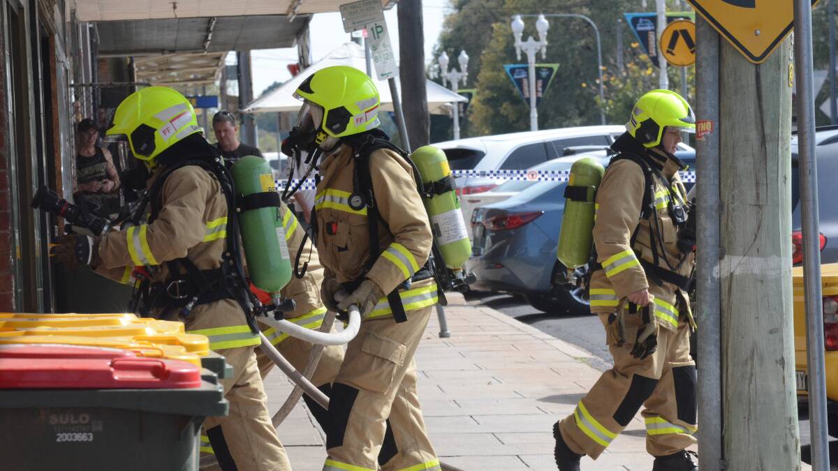 FIRE: Emergency services were called to a fire at a Keppel Street business yesterday morning. Photo: PHILL MURRAY 	    041916pfire1