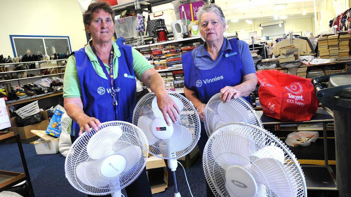POWER SURGE: St Vincent de Paul volunteers, including Janet Reddan and Ros Brander, are unable to accept donated electrical items. Photo: STEVE GOSCH 1012sgvinnies1
