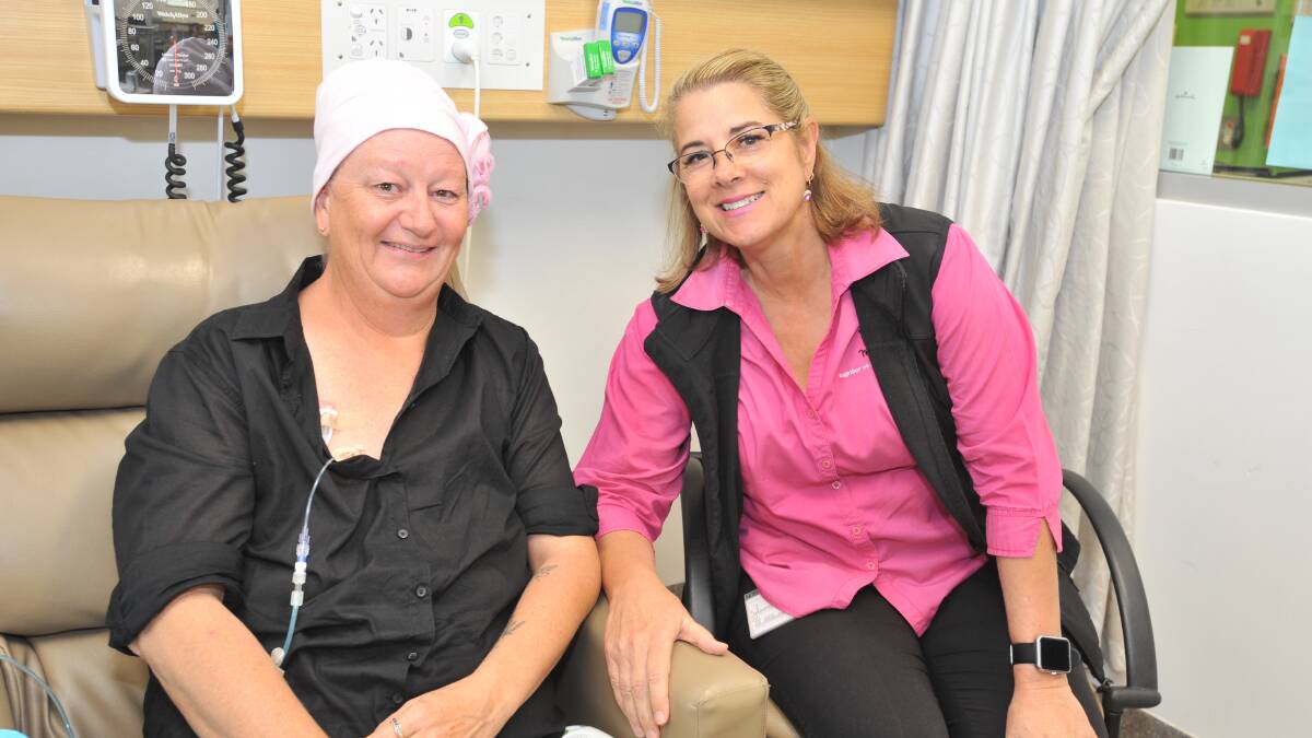 GETTING THE FACTS: Breast cancer patient Cindy Hoad with McGrath Foundation breast care nurse Sue Kuter, who says a talk by genetic oncologist Dr Hilda High will help people concerned about cancer risk better understand the role of genetics and how they can stay healthy.  Photo: JUDE KEOGH 0309cancer2
