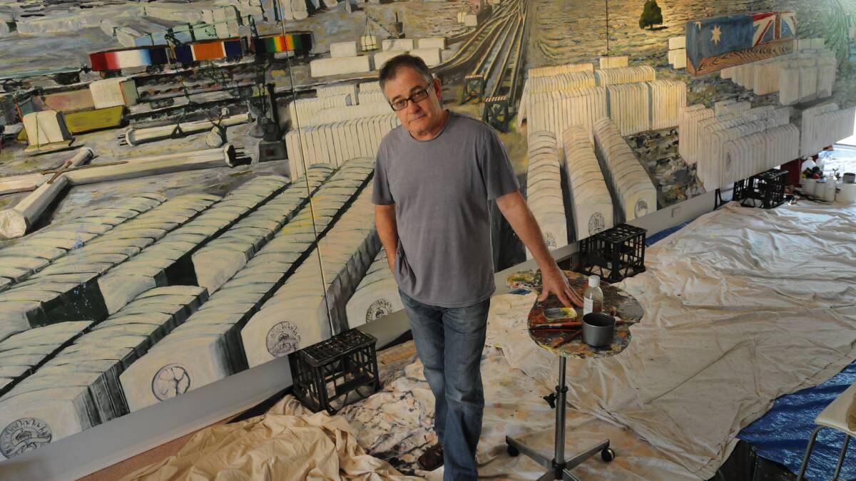 OUR SACRIFICE: Orange artist Victor Gordon with a large-scale panelled painting that will be one of the components of his exhibition to commemorate the sacrifices of World War I. It will open at Orange Regional Gallery in April. Photo: STEVE GOSCH				     	                       0119anzac