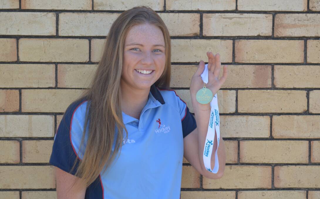 OVER THE MOON: Chloe Barrett was superb for NSW, helping the side win gold at the under 21 indoor hockey national championship. Photo: MATT FINDLAY 		             0119mfchloe2