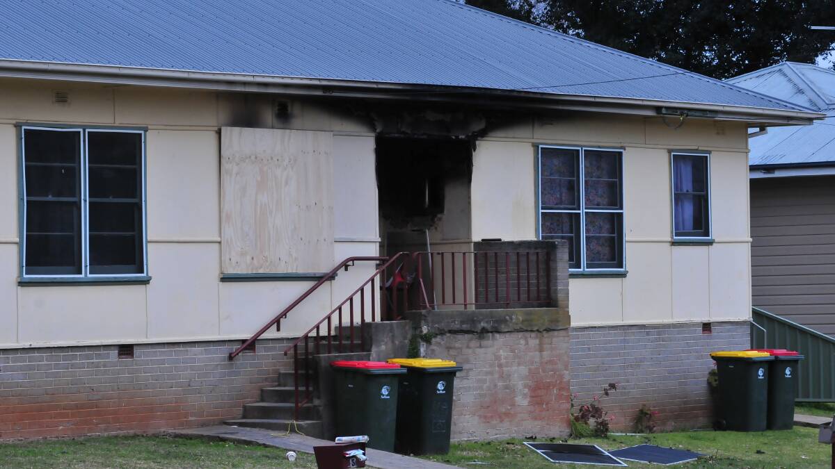 BOARDED UP: This Maxwell Avenue house was divided into three social housing units. Photo: JUDE KEOGH		     0705fire3