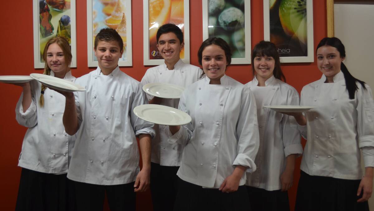 SERVING UP EXPERIENCE: Taleise Pickavance, Jack Little, Slade Massang, Maggie Gorham, Caitlin Hargreaves and Kasi Tarr gained valuable hospitality experience service on tables at the recent Catholic parish dinner celebration.
Photo: JANICE HARRIS 0611food
