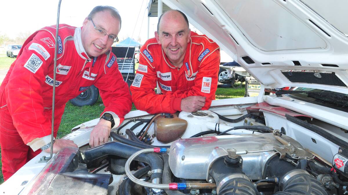 CHALLENGING RALLY: Steve Hodgkin and Russel Winks from Canberra with their VK Commodore replica with a rare twin throttle body 308 engine.  Photo: JUDE KEOGH  0531rally8