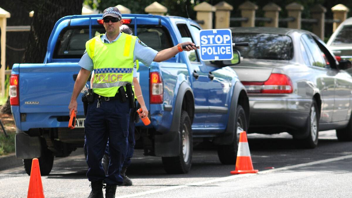 PROACTIVE POLICING: Leading senior constable Wes Bush at the Bathurst Road random breath testing site yesterday morning. Photo: STEVE GOSCH 0102sgpolice
