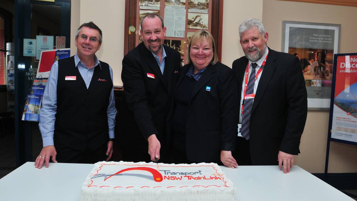 CELEBRATION: Trainlink senior customer service attendant David Rome, travel centre manager Mick Herft, senior customer service attendant Sue Atkin and  regional service delivery manager Michael Meredith  with the anniversary cake. Photo: JUDE KEOGH     0701trainlink1