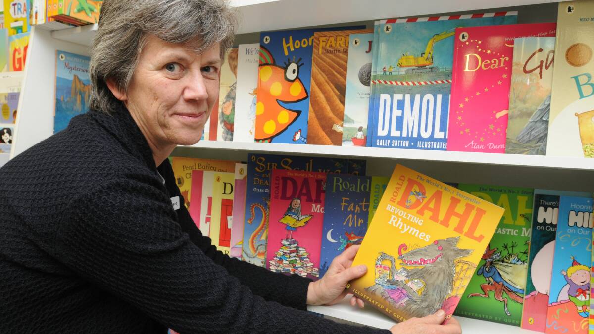 WAR OF WORDS: Collins Booksellers co-owner Margaret Schwebel says a controversial word in Roald Dahl’s Revolting Rhymes needs to be read in context. Photo: STEVE GOSCH 						            0829book2
