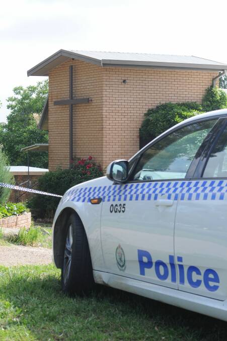 Police established a crime scene around the church. Photo: STEVE GOSCH 