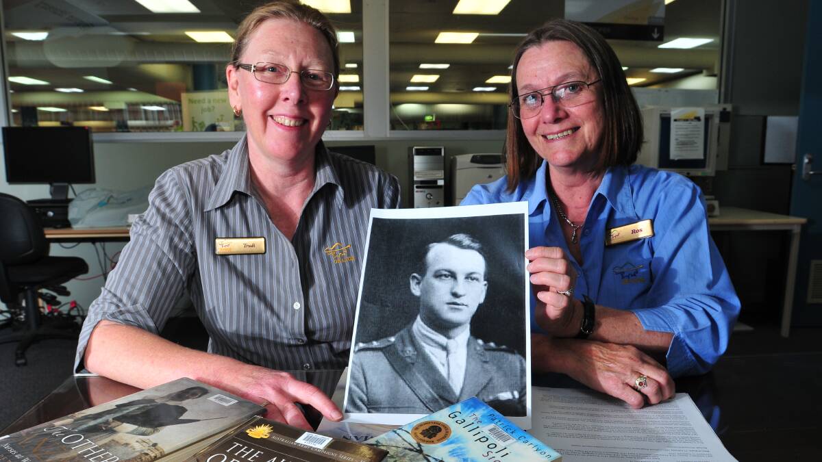 DEEP DIGGING: Central West Libraries librarian Trudi Mayfield and technical services librarian Ros Dorsman say the story of John Patrick Hamilton VC is a particularly special piece of Orange history. Photo: JUDE KEOGH  0423warman1
