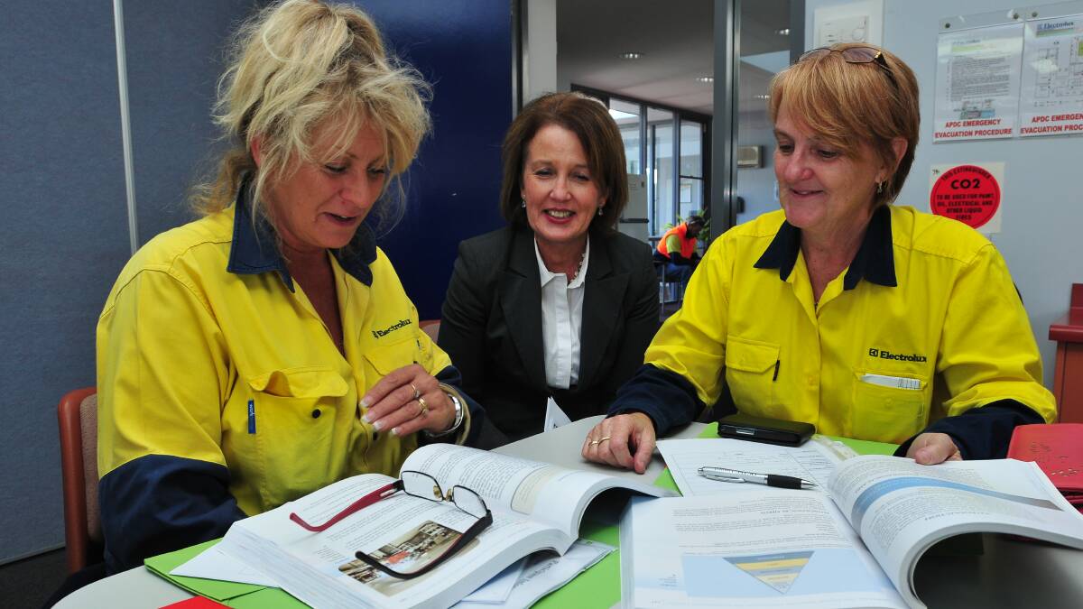 OPTIONS: Elizabeth Majewski and Janet McLean discuss a certificate III in aged care with OCTEC manager of community services in health Liz Gray. Photo: JUDE KEOGH      0430octec1