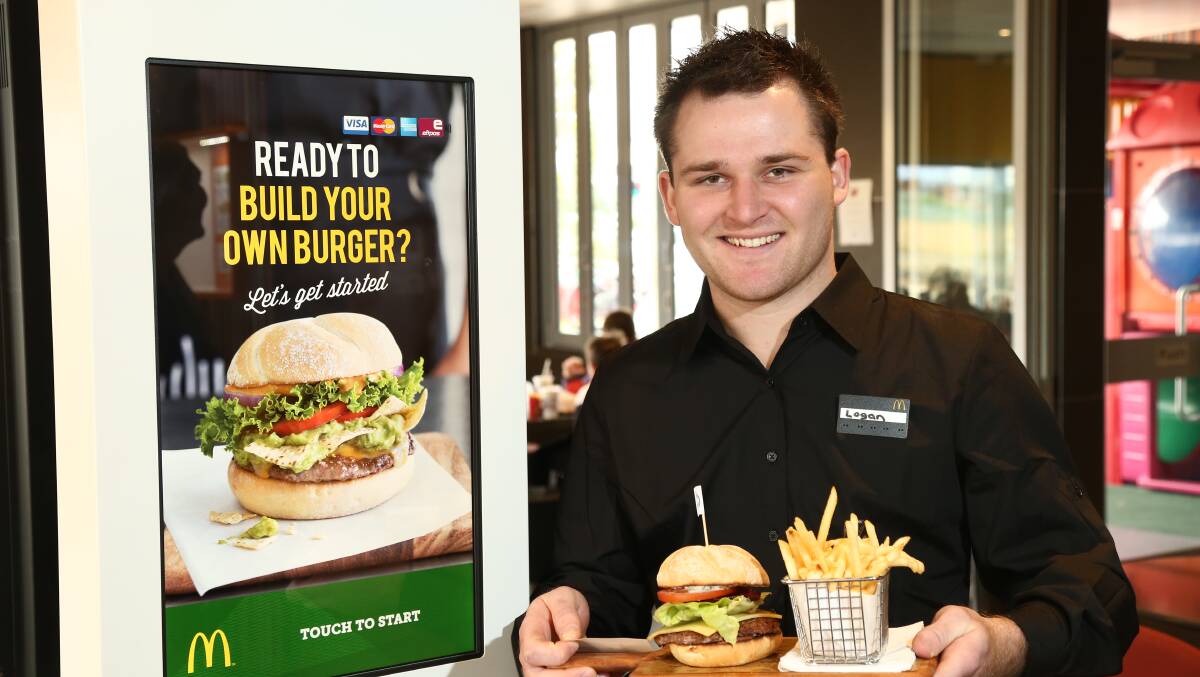 NORTH Orange McDonald’s is one of the test sites to trial the new Create Your Taste range of hamburgers, which allow customers to make their own burgers from a choice of around 30 different ingredients. Pictured is Logan Hareb.			 Photo: PHIL BLATCH 0408pbmcdonalds1

