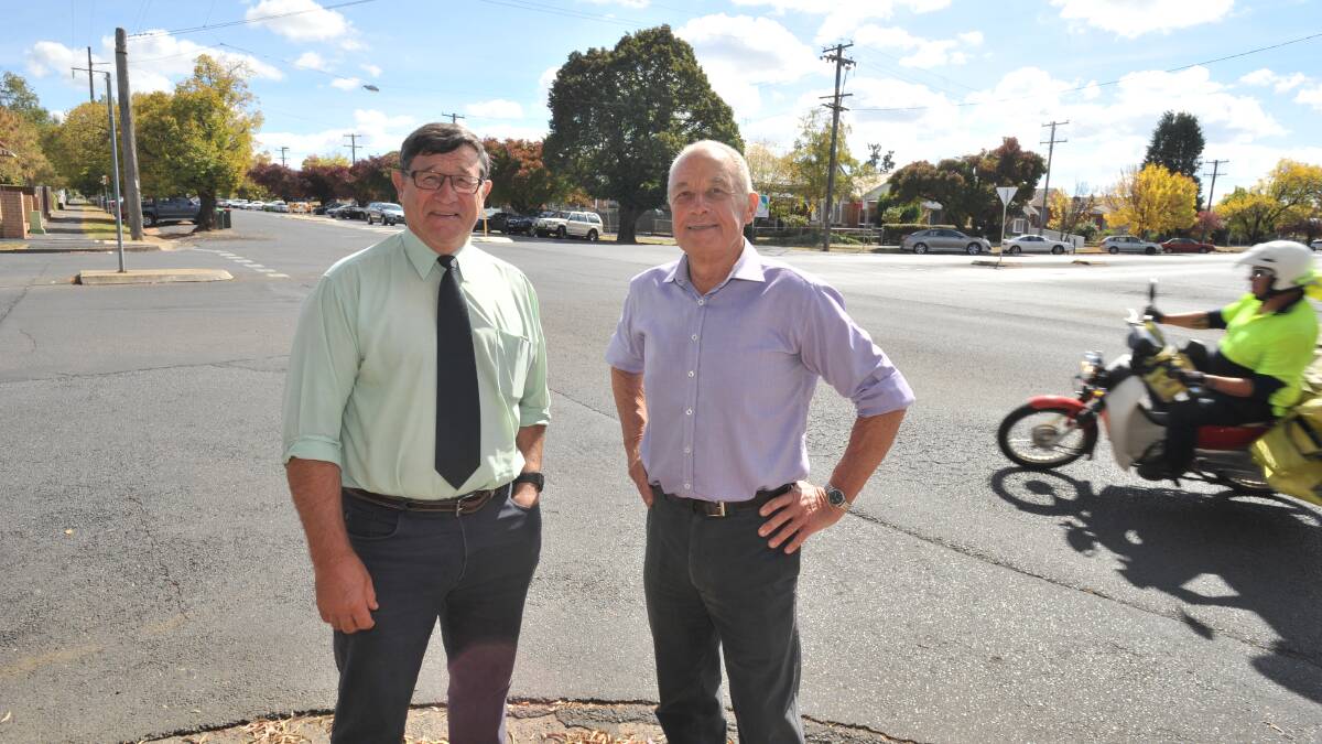 FUNDING BOOST: More than half of the latest round of NSW Black Spot funded projects for the Calare electorate are in Orange. Member for Calare John Cobb and Orange City Council traffic committee chair, councillor Russell Turner, on the corner of Lords Place and March Street where a new roundabout will be installed. Photo: JUDE KEOGH 	           0414roundabout3
