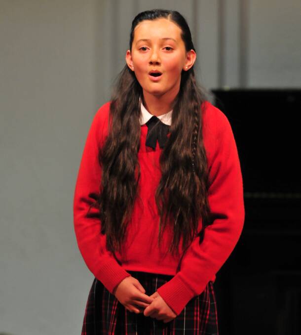 BEAUTIFUL VOICE: First time performer at the eisteddfod, Mikaela Webb of Orange, took out second place in the 12 years folk solo section. Photo: JUDE KEOGH 0812eist1
