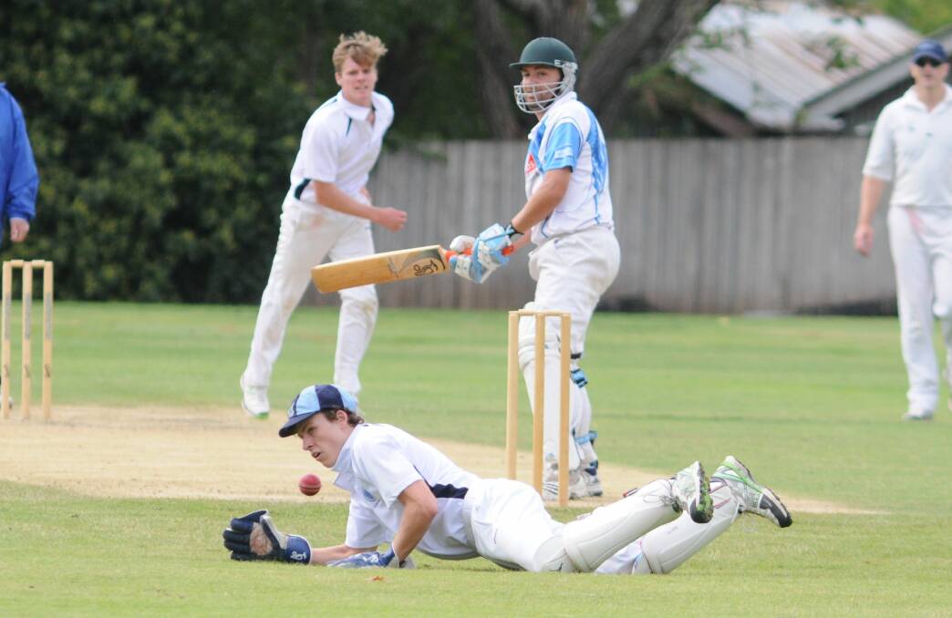 CRICKET: Kinross wicketkeeper Max Manson dives for the ball in his side's ODCA first grade win against Waratahs on Sunday. Photo: STEVE GOSCH