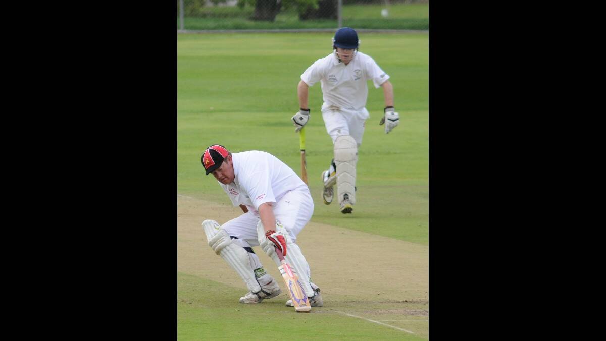 CRICKET: Centrals pair Dean Turner and Max Dodds take a couple of runs against Orange City in their ODCA first grade game on Sunday. Photo: STEVE GOSCH