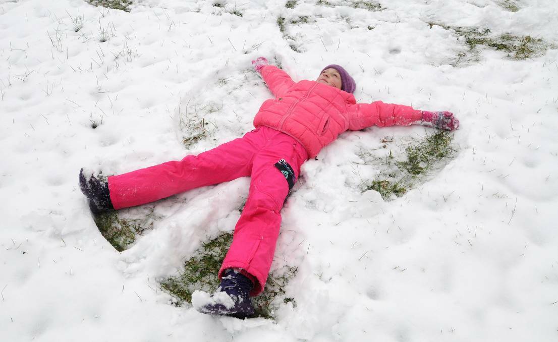 WINTER WONDERLAND: Dasha Nagornova playing in the snow in Orange in 2015. Photo: STEVE GOSCH