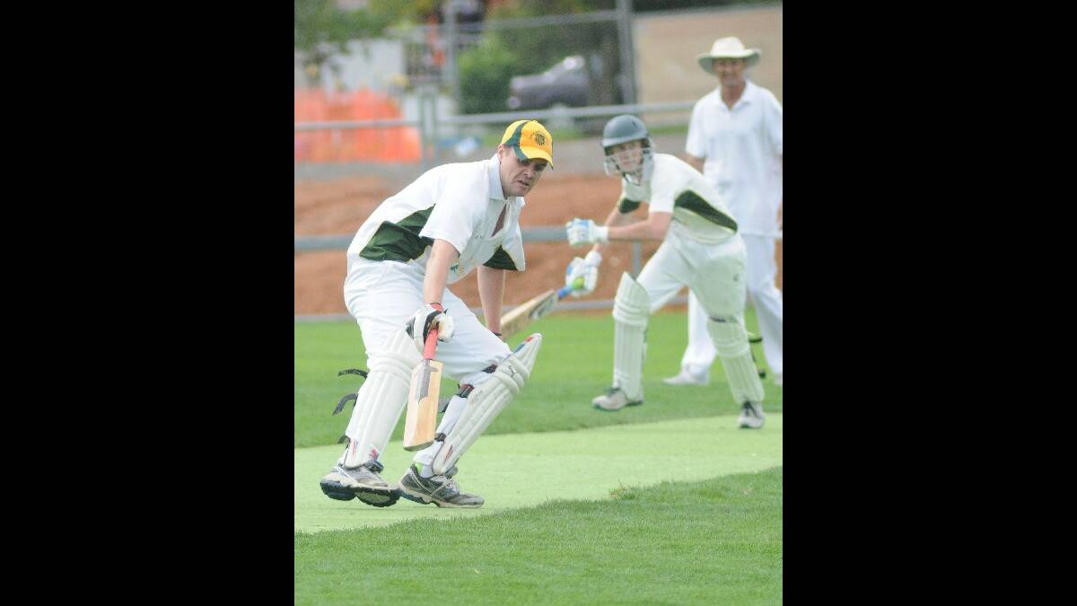 CENTENARY CUP: Orange CYMS' batsmen Pat Duffy and Jeremy Finlayson look for runs in their side's loss to Kinross Wolaroi at Sally Kennett Field on Saturday. Photo: STEVE GOSCH