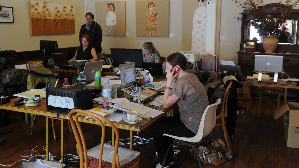MISSION CONTROL: Staff hard at work in the location office. Photo: STEVE GOSCH
