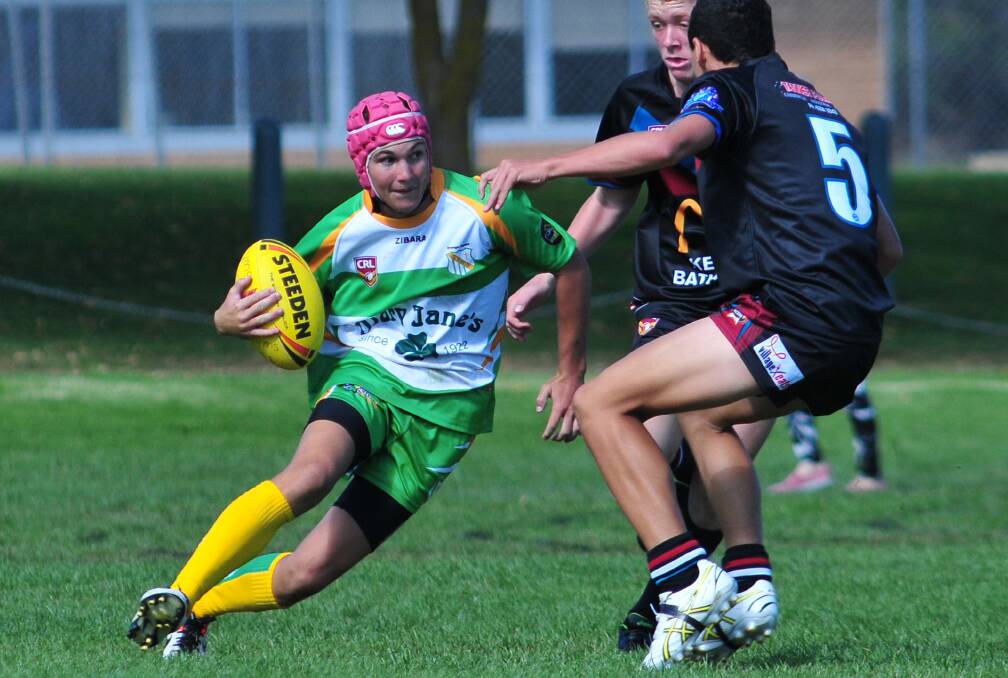 RUGBY LEAGUE: CYMS' Hugh Gibson looks to avoid the Bathurst Panthers defence in their under 15s clash. Photo: STEVE GOSCH