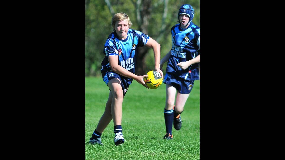 RUGBY LEAGUE: Bloomfield's Tom Blimka attacks the Bathurst St Pat's defence in their under 15s game. Photo: STEVE GOSCH
