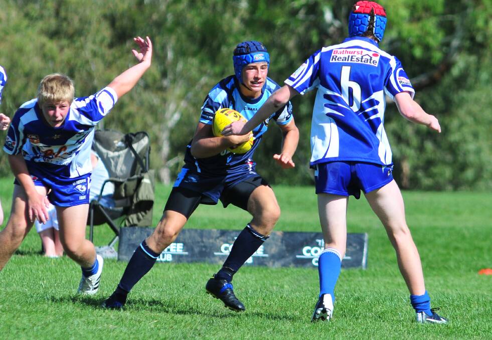 RUGBY LEAGUE: Bloomfield's Tom Ford proves hard to handle for the Bathurst St Pat's defence. Photo: STEVE GOSCH