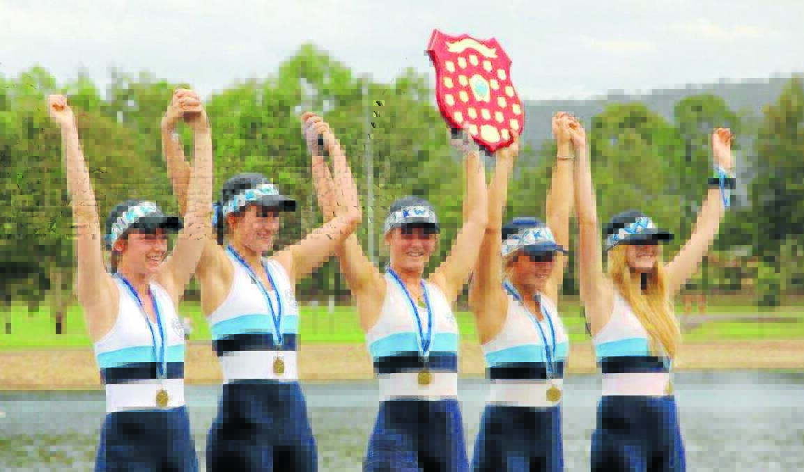 GIRLS POWER: Kinross Wolaroi's Madeline Hawthorne (left), Meg Crouch, Georgina Uttley, Nicola Thomas, and Siobhan Herbert lift the Union of Boat Race Officials Shield after winning the schoolgirl coxed quad scull on Sunday.