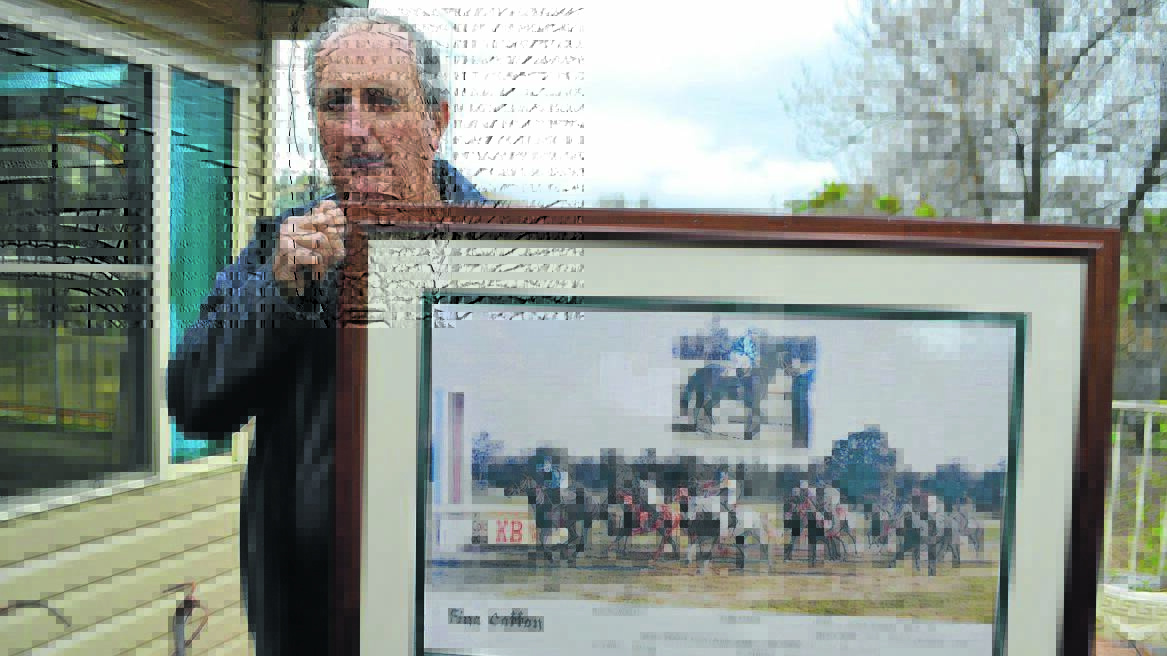 FINE MESS: Peter Payne with a family memento of Fine Cotton.