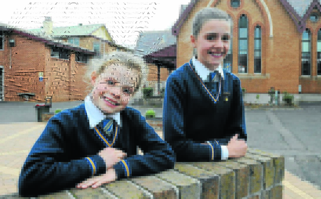 GIFT OF THE GAB: Orange Public School students Eloise Milne and Gabby Shilling who finished first and second respectively in their years at the Country Women’s Association public speaking competition in Bathurst. Photo: STEVE GOSCH                                0601sgops2