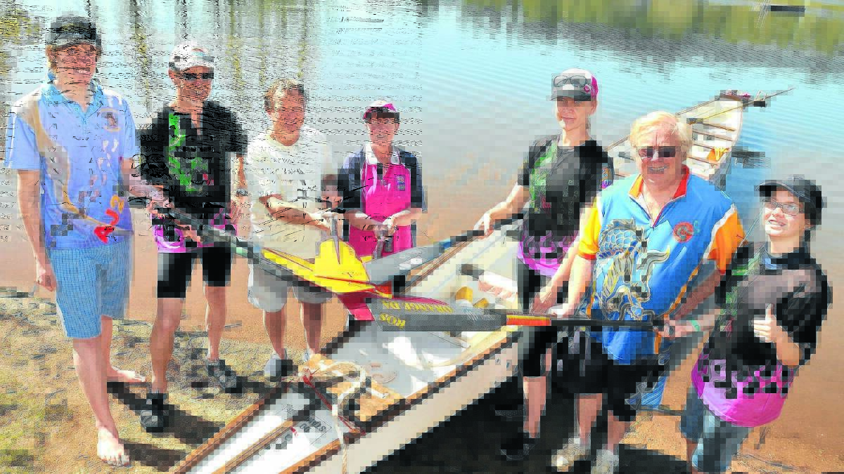 PICK UP A PADDLE: Pinnacle Dragons Abreast club members Jacob Wright, Warren Mason, Phil Beeby, Gail Wright, Frea Hansen, Roger Merritt and Vanessa Drabsch encourage people to experience dragon boat racing at an upcoming try-out day.  Photo: STEVE GOSCH                                0913sgdragon

