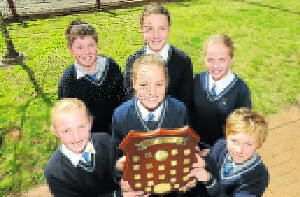 MIND-BLOWING: Orange Public School students (back) Cezar Dihel, Amber Shilling, Madeleine Owens, (front) Emily L’Estrange, Kate Burdack and Darcy Climpson won the NSW Western section of the Tournament of Minds. Photo: STEVE GOSCH                                                                                              0827sgtournament1
