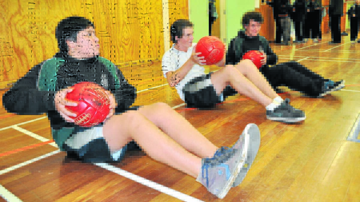 ON THE BALL: Canobolas students (from left) Kaleb Masila, Ben Hazzard and Jacob Skelton get active during the Premier's Sporting Challenge.
Photo: NICK McGRATH 0723nmcanobolas1