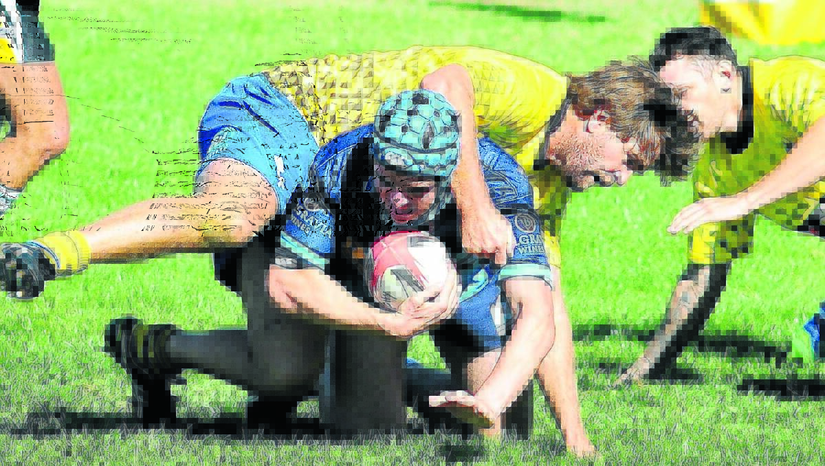 YOU’RE NOT GOING ANYWHERE: Central West colts player Ethan Kelly is tackled during the Orange City Rugby 10s at Pride Park on Saturday. Photo: STEVE GOSCH 0319sgrugby3
