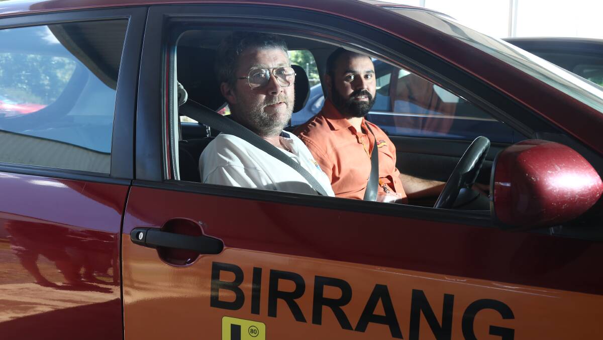 DRIVER EDUCATION: James Kemp gets driving instruction from Nick Frail at Birrang. Photo: PHIL BLATCH 1117pbdriver1