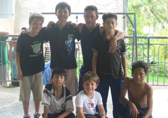 PRACTICE MAKES PERFECT: Charles Sturt University Orange students working with children with disabilities and their carers at Chua Ky Quang, a Buddhist temple and orphanage in Cambodia.