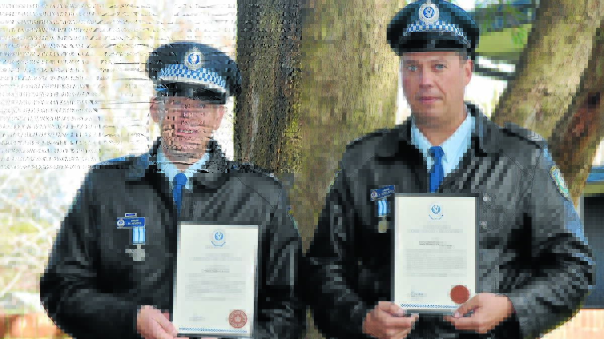 A FAIR COP: Sergeants Mark Hevers and Rolf Vogelsang  received the commissioner’s commendation and medal for courage at the NSW Police Force local area command medals and awards presentation ceremony yesterday. Photo: MATT FINDLAY                                                                 0611mfcops3