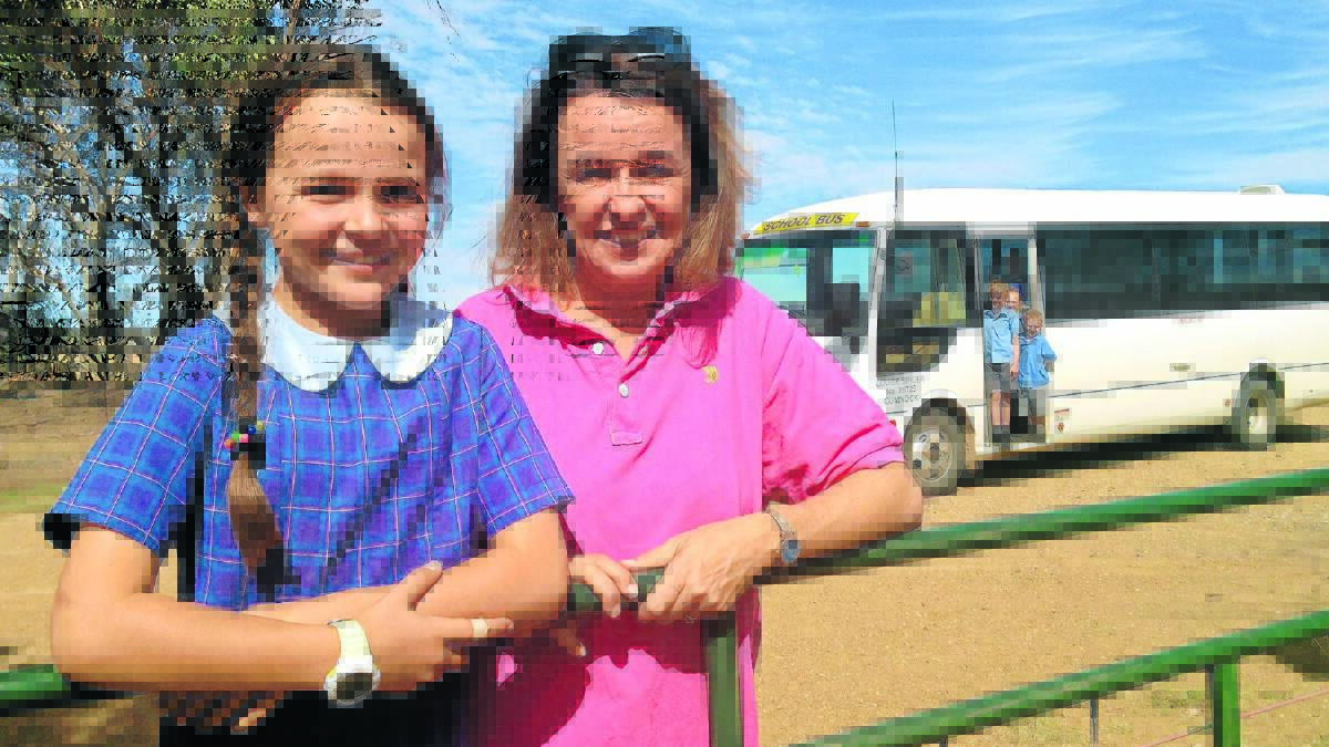 CAMPAIGN RESTARTS: Skye and Christine Weston in front of the bus that picks up Cumnock Primary School students from the surrounding farming community but with school enrolments decreasing the school bus services may also decline. Photo supplied