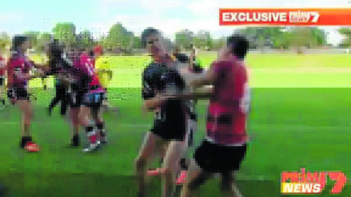 UGLY: The brawl between Dubbo College and Orange High School students spills over the sideline. 
Photo courtesy of Prime 7