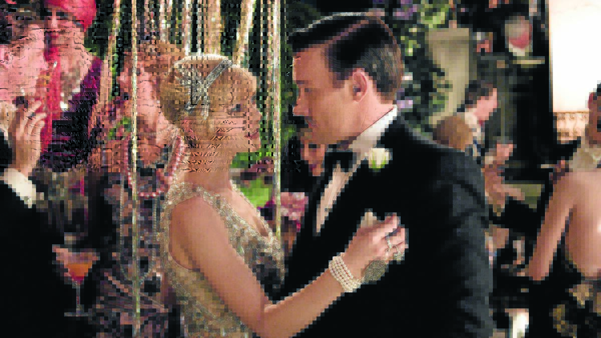 DRESS THE PART: Carey Mulligan as Daisy Buchanan and Joel Edgerton as her husband Tom in a scene from The Great Gatsby.