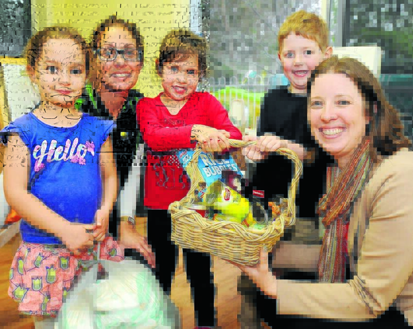 YOUNG INITIATIVE: Hill Street Children’s Centre’s Caitlyn Long, preschool teacher Nicole Sullivan, Hannah and Henry Chapman and Helpa Collective founder Lee Chapman with donated items for homeless people in Orange. Photo: STEVE GOSCH