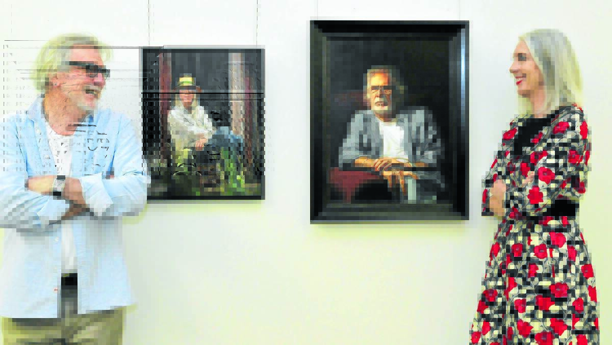 MIRROR IMAGE: Michael Caulfield and Doone Grist admire their portraits painted by award winning artist Sally Ryan which go on exhibition on Friday night. Photo: JUDE KEOGH0930artist
