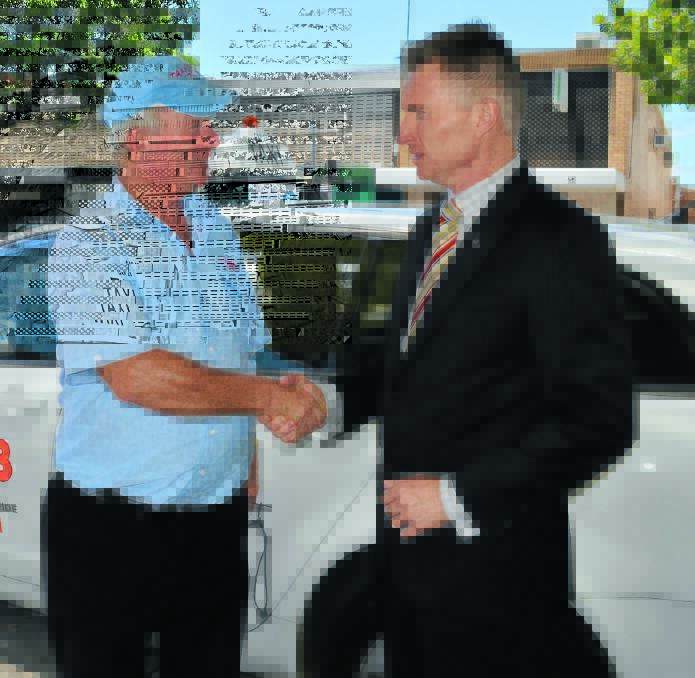 INDUSTRY FOCUS: Taxi Cabs of Orange driver Barry Buckland met with NSW Taxi Council CEO Roy Wakelin-King when he visited Orange yesterday. Photo: TANYA MARSCHKE 