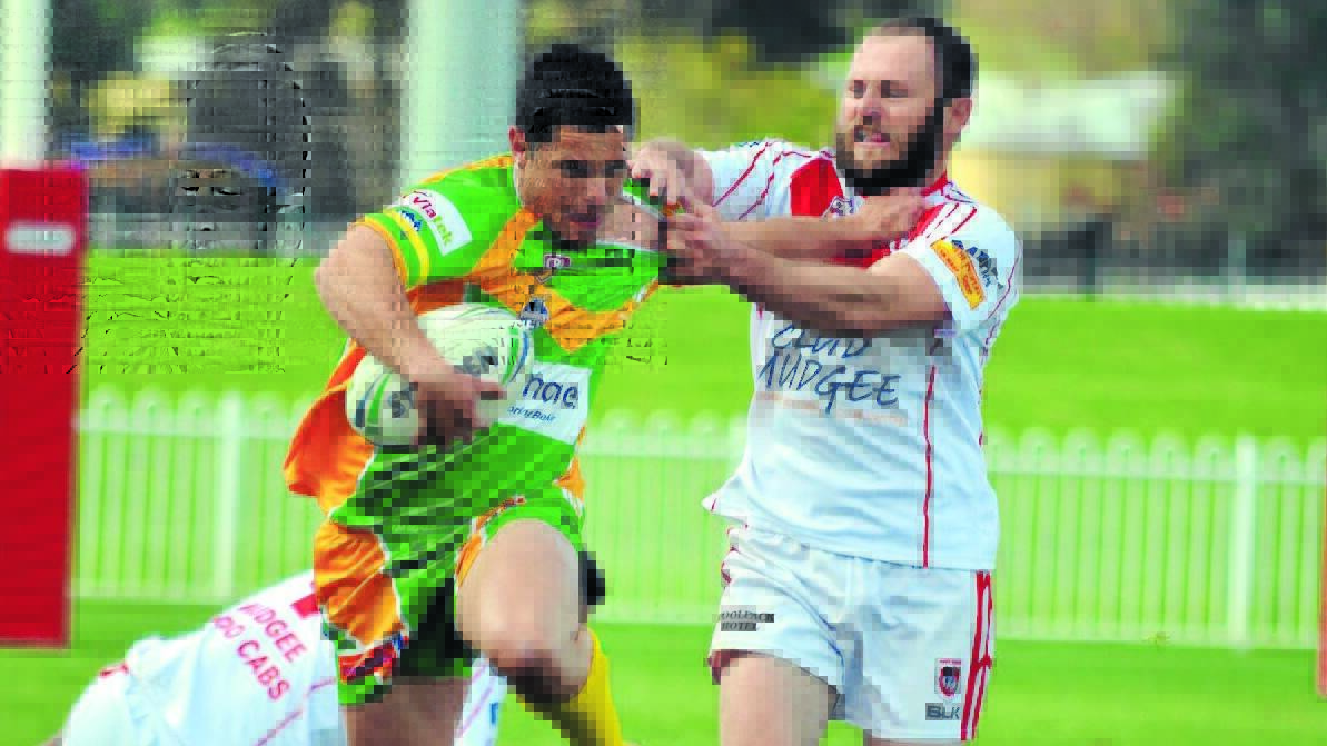 COLLARED: Orange CYMS' Wayne Collet is rounded up by the Mudgee Dragons defence on Sunday. Photo: BEN HARRIS