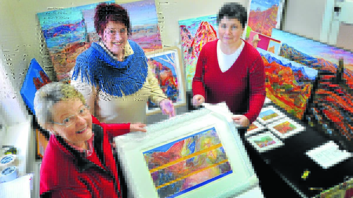 ARKAROOLA ART: Artists Beverley Duncan, Joy Engelman and Cherelynee Carden spent Saturday packing up the 80 artworks to take them to Sydney. Photo: STEVE GOSCH  0809sgart1