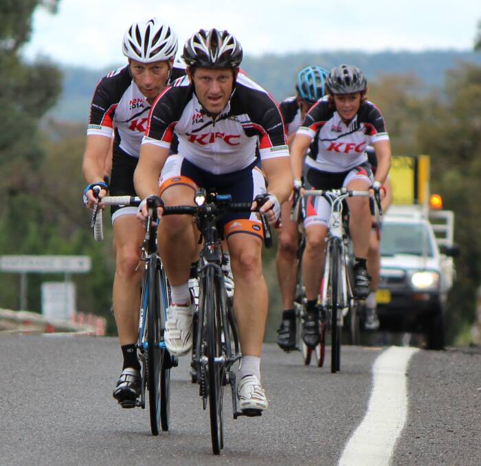 HARD SLOG: Riders in the last Mill 2 Mill charity ride (left to right) Paul Hume, Craig Healey and Tina Jones tackle the Bumberry Ranges between Parkes and Manildra. Photo: CONTRIBUTED