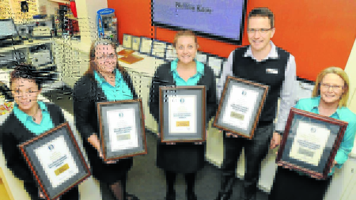 SUCCESSFUL: Hansen Optometrists staff Rebecca Oliver, Jane Merchant, Faith Grant, Justin Clunas and Patricia Oliver show off a swag of awards won for business excellence. 
Photo: STEVE GOSCH 0529sghansen1